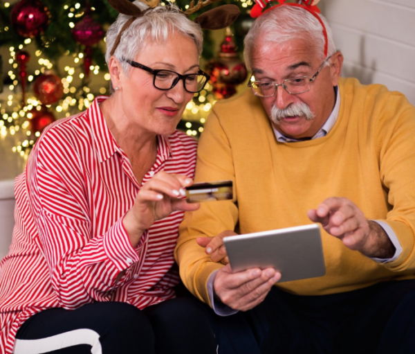 senior couple looking at laptop